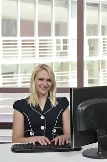 Businesswoman At Work Drucke: Woman executive or manager using a desktop computer
