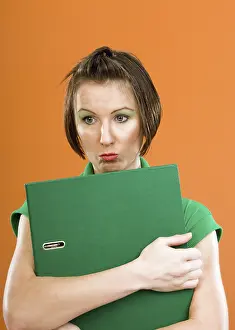 Businesswoman Holding Folder Drucke: Woman with folder