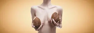 Cosmetic Healthcare System Drucke: Woman posing in the studio with coconuts in her hands