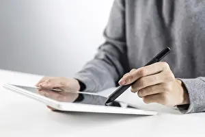 Business Attire And Technology Drucke: Woman using tablet computer for project management