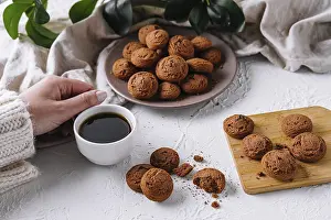 Empty Table With Baked Goods Drucke: Woman's hand reaching for a cookie