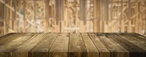 Empty Construction Site Drucke: Empty wood table surface display background with construction theme behind