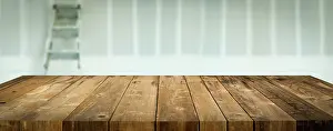 Wooden Table Background Drucke: Empty Wood Table Surface Display Background with Construction Theme Behind
