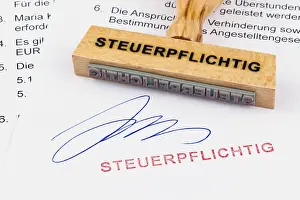 Office Supply Drucke: A wooden stamp is placed on a document