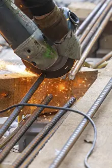 Handicrafts In Southern Germany Drucke: A worker cuts metal bars with a flex