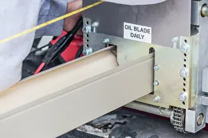 Rain Gutter Installation Drucke: Worker Measuring Rain Gutter Processing Through Seamless Shaping Machine