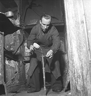 Black And White Factory Scene Drucke: Workers in the 1940s. Interior of a mechanical workshop for musical instruments