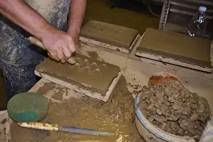 Patmos Cotto Brickworks Drucke: Worker's hand carving patterns in clay bricks