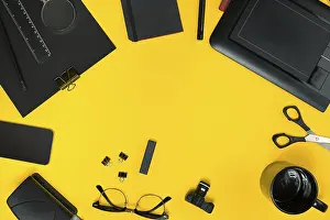 Copy Space Image Drucke: Workplace with office items and business elements on a yellow background