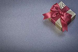 Christmas Gift Wrapping Ideas Drucke: Wrapped present box on grey background holidays concept