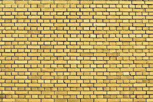 Yellow Brick Wall Background Drucke: Yellow brick wall background