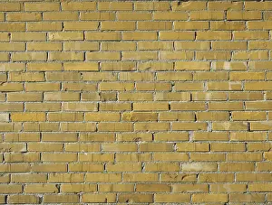Bilder Datiert 23. April 2024: Gelber Ziegelmauerhintergrund