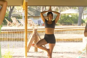 Yoga For Wellbeing Drucke: Yoga instructor practicing the tree pose