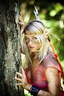 Rainforest Landscape Photography Drucke: A young amazon with a bow in the rainforest