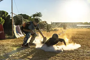 Dusty Baseball Field Drucke: Young baseball player slides into base