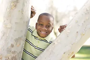 Young Boy Playing Outside Drucke: Young boy having fun in the park
