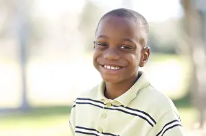 Young Boy Playing Outside Drucke: Young boy having fun in the park