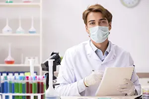 Scientific Researcher Drucke: Young chemist working in the lab