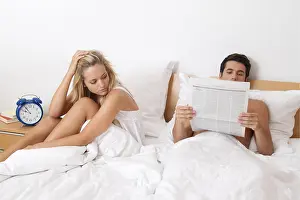 Young Couple Problems Drucke: A young couple in bed having problems and crisis
