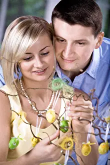 Caucasian Family Photos Drucke: Young couple looking at Easter decorations