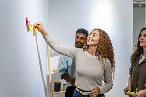 Young Professionals Working Together Drucke: Young diverse team collaborating on a project