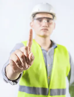Adult Male Construction Worker Drucke: Young engineer counting number one isolated
