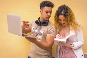 Computer Workstation Drucke: Young entrepreneur couple doing teamwork with a computer