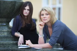 Young Female Students Drucke: Two young female students on campus between classes