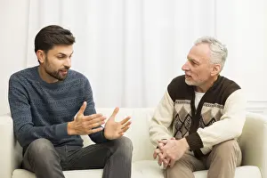 Exhausted Man Drucke: Young guy aged man sitting sofa