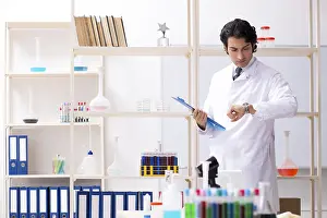 Virus Analysis Drucke: Young handsome chemist working in the lab