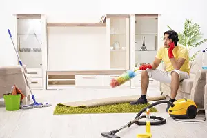 Male Household Chores Drucke: Young handsome man doing housework