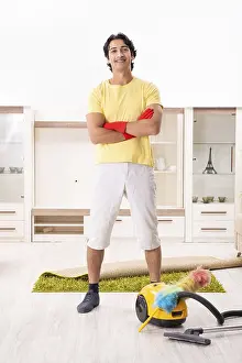 One Person Household Chores Drucke: Young handsome man doing housework