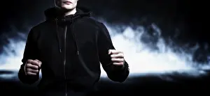 Martial Arts Concept Drucke: Young kickboxer posing in the studio