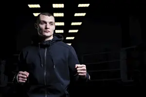 Martial Arts Concept Drucke: Young kickboxer posing in the studio