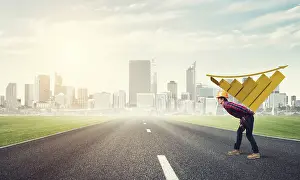 Young Construction Worker Drucke: Young man builder carrying growing graph on his back