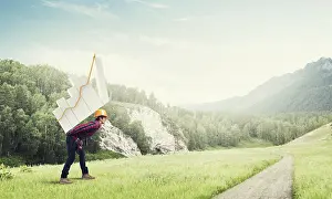 Young Construction Worker Drucke: Young man builder carrying growing graph on his back