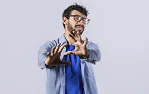 Stressed Young Adult Drucke: Young man with rejection expression isolated
