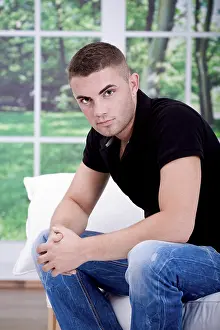 Caucasion Male Model Drucke: Young man on a sofa