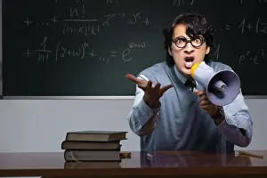 University Lecturer Drucke: Young math teacher in front of chalkboard
