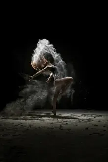 Athletic Female Model Drucke: Young model dancing in a cloud of white dust studio shot