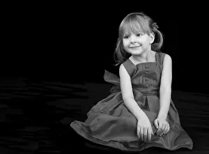 Studio Portrait Photography Drucke: Young model posing on black background