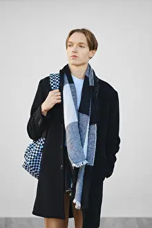 Young Fashion Model Drucke: Young student with backpack in old wool coat