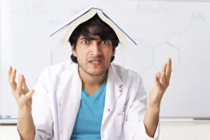 Educational Institution Images Drucke: Young student chemist in the classroom