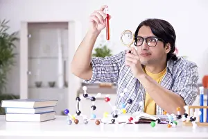 Single Person Studying Drucke: Young student physicist preparing for exam at home