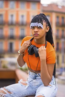Young Trap Dancer Drucke: A young trap dancer with braids