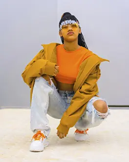 Young Trap Dancer Drucke: A young trap dancer with braids