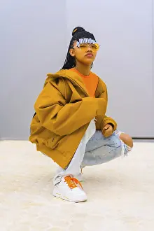 Young Trap Dancer Drucke: A young trap dancer with braids