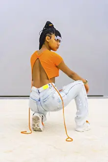 Young Trap Dancer Drucke: A young trap dancer with braids