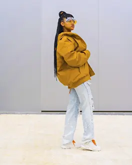 A young trap dancer with braids