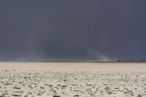 Colorful African Landscapes Drucke: A storm approaching the salt pan